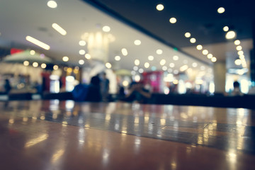 wooden table empty of display in cafe with luxury light decoration
