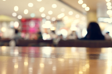 wooden table empty of display in cafe with luxury light decoration