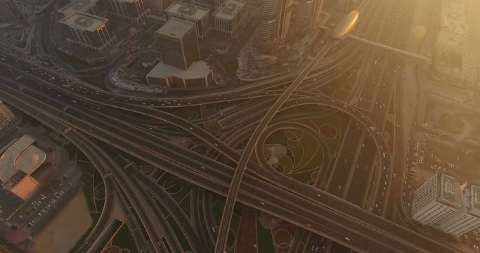 DUBAI, UAE - JANUARY 2, 2017: Aerial view of Sheikh Zayed Road desert Intersection and Dubai Metro. Sheikh Zayed Road is the main artery of the city.The highway runs parallel to the coastline.