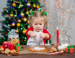 cute little girl baking Christmas cookies