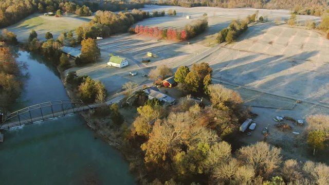 Aerial reveal of working grist mill by the river