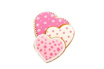 Background from pink cookies heart shaped with different patterns, isolated