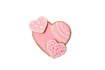 Background from pink cookies heart shaped with different patterns, isolated