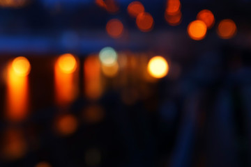 abstract background of colorful blurred defocused bokeh street lights. motion and nightlife concept.