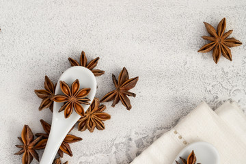 Natural anise star spice on white concrete background.Close up