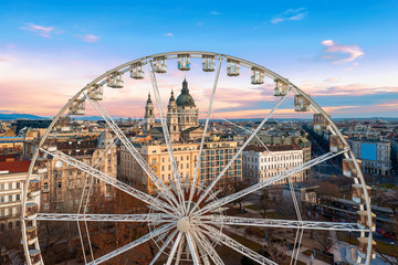 Europe, Hungary, Budaopest. Ferris wheel In Hungary Budapest. Erzsebet square, St Stephen Basilica,...