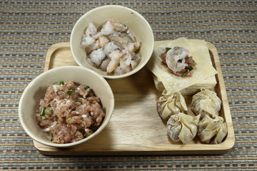 Chinese Wonton wrapper and main ingredient such as minced pork and chopped shrimp.