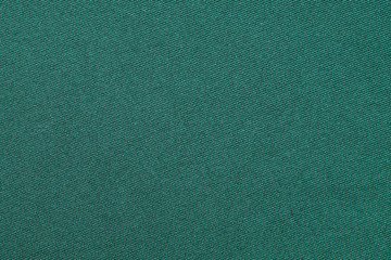 Top view of Beautiful cloth fabric texture background of green dress. Soft surface detail with wave and motion. Decorative, fashion concept with copy space for text.