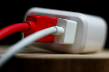 charger with colored wires on a dark background