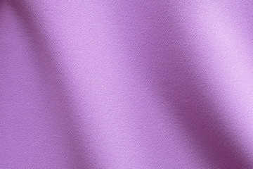 Top view of Beautiful cloth fabric texture background of pastel purple dress. Soft surface detail with wave and motion. Decorative, fashion concept with copy space for text.