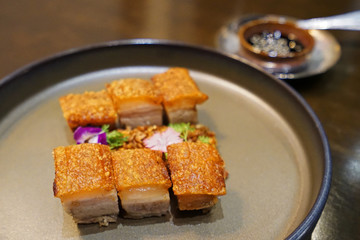 Close up plate of barbecue crispy pork belly
