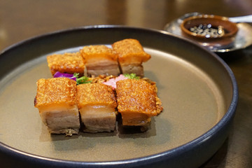 Close up plate of barbecue crispy pork belly