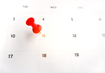 Thumbtack a date on calendar concept for important date, meeting reminder, planning for business, travel planning concept