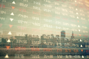 Forex graph on city view with skyscrapers background multi exposure. Financial analysis concept.