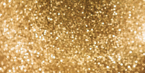Golden blurred sparkles glowing background