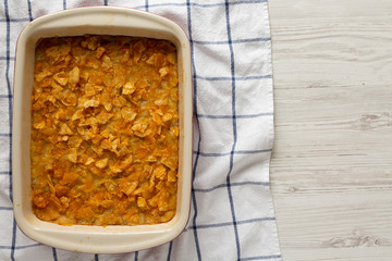 Overhead view, Homemade Funeral Potatoes Casserole in a dish. Flat lay, top view, from above.