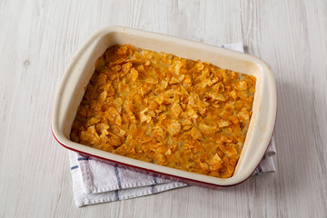 Homemade Funeral Potatoes Casserole in a dish, low angle view.