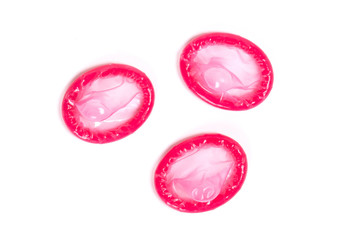 Red condom, isolated