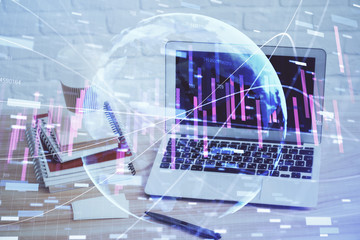 Financial graph colorful drawing and table with computer on background. Double exposure. Concept of international markets.