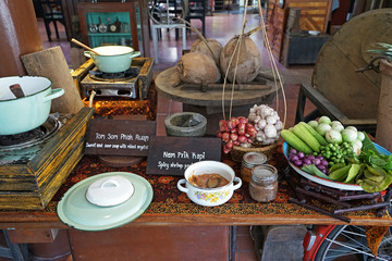 Arrangement of Buffet self service station of 'Nam prik kapi' spicy shrimp paste and 'Tom som phak ruam' sweet and sour vegetables soup, Thai southern cuisine
