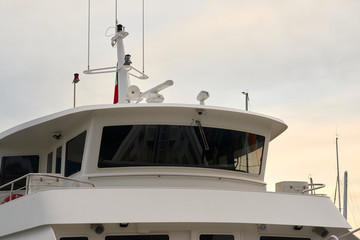 Naklejka premium detail of white ferry cockpit in a harbour