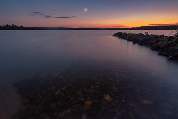 Dawn with moonshine over the sea