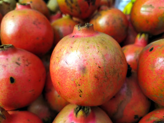 red fresh sweet pomegranate put on a shop