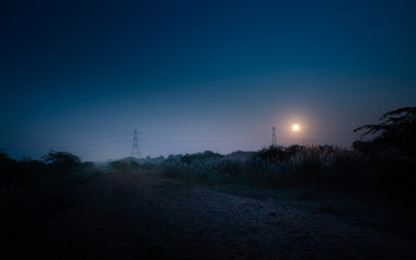 sunset in city of jeddah at night with moon and stars