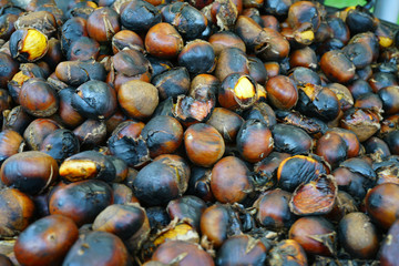 Roasted chestnuts in a pan for sale in the street in Paris