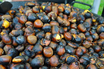 Roasted chestnuts in a pan for sale in the street in Paris