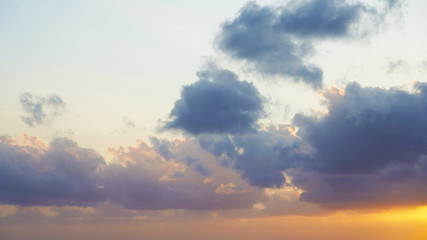 incredible orange blue sky with small clouds at sunset. background of bright sunset sky.
