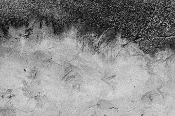 Texture of a concrete wall with cracks and scratches which can be used as a background