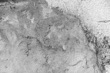 Texture of a concrete wall with cracks and scratches which can be used as a background