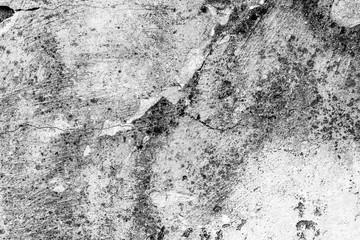 Texture of a concrete wall with cracks and scratches which can be used as a background