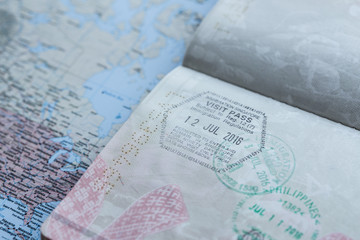 Inside page of a well traveled european passport with all kinds of stamps 