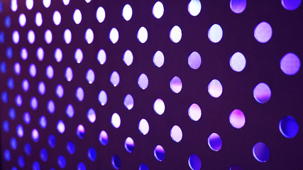 texture of colored circles on a gray background. geometric abstraction, neon light. phantom blue, orange peach color.