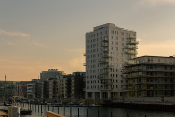 The modern apartment buildings next to the old dry dock, converted to a marina, in Malmö, Sweden