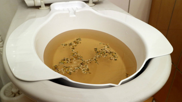 Additional bidet, bowl for sitting baths, with herbs.