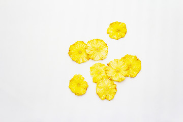 Dried slices of pineapple isolated on white background