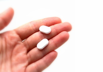 Two pills in the hand. The medicine. Treatment. Chemistry. Therapy. Doctor.