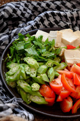 Raw material for Vietnamese vegan soup from okra, tofu, tomato, Eryngium