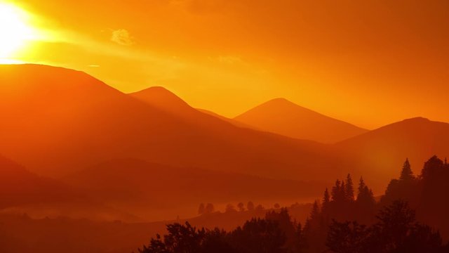 Beautiful sunset over mountains and village houses