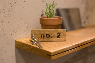 room key on a wooden shelf