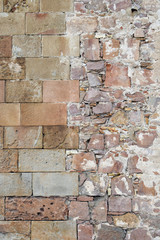 Ancient Textured Stone Wall Divided into Rough & Smooth Halves 