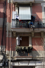 Apartment Building with Balconies & Laundry Drying in Sun 