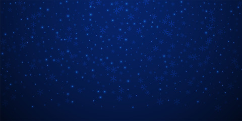 Sparse glowing snow Christmas background. Subtle f