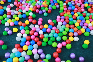 Many colorful plastic balls on children's playground