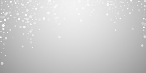 Obraz premium White dots Christmas background. Subtle flying sno
