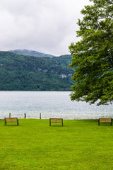  Benches on a lawn at a lake