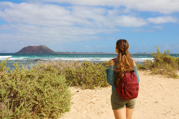 Young female backpacker hiking in Fuerteventura Island, Spain